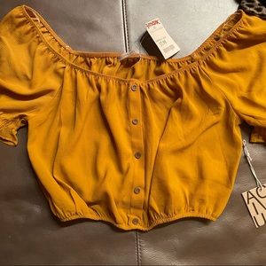 Stretchy kinda orange/yellow off shoulder top never worn new with tags